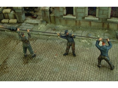 German tankers cleaning gun barrel - WWII 